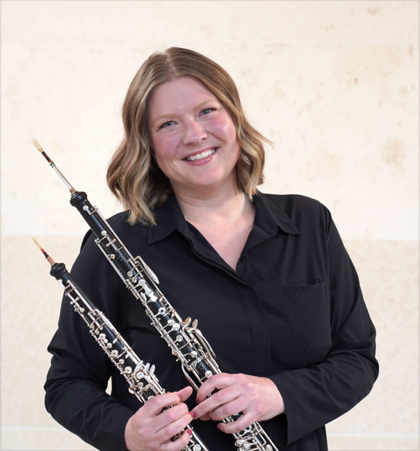 Lindsay Flowers holding two oboes