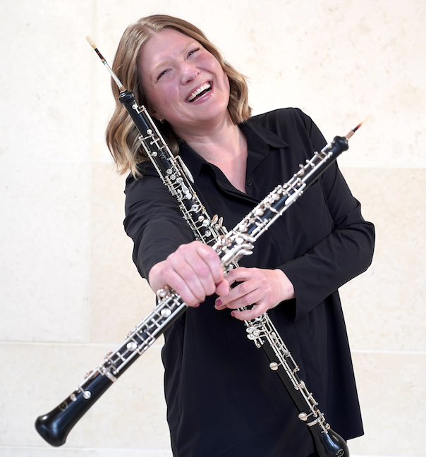 Lindsay Flowers holding two oboes